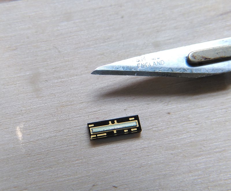 One of the sensors with a scalpel blade for scale