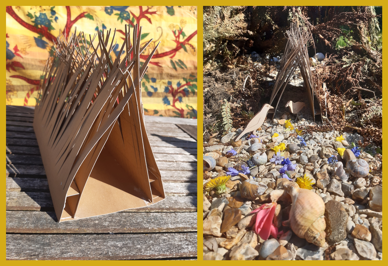Two photos - on the left is a card model shaped like a tent with spikes at the top, on the right is the same model in a garden, with stones, flowers and shells placed around it, and two small wood birds.